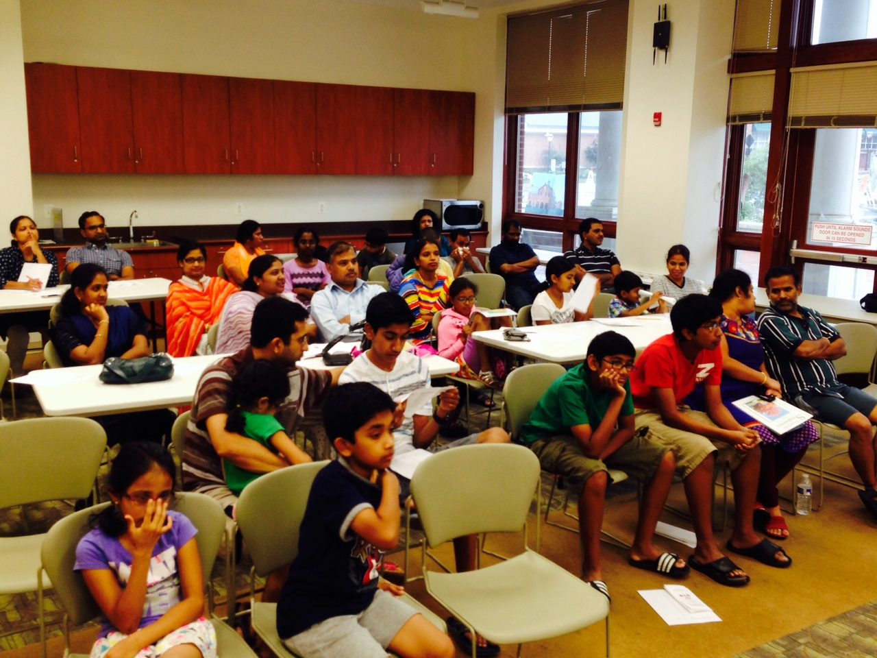 Mathemagics 2014 @ City of Fairfax Regional Library, Virginia - Audience while solving a puzzle.