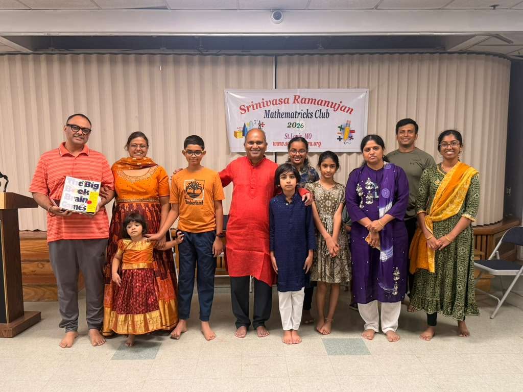 Families and teachers at Medhavadhanam 2026, Hindu Temple of St. Louis, in front of the Srinivasa Ramanujan Mathematricks Club banner