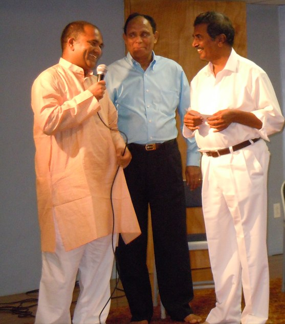 Sreenivasa Ainapurapu on stage with Sri Kesana RamaPrasadrao and Sri Polineni Subbarao, founder of the Bright Life Foundation